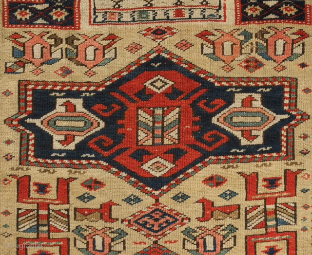 Kuba prayer rug, dated to 1884 according to the mixed Arabic and Western numbers in the inscribed date. Yellowish ground.  Kufic borders. Double headed birds and animals in the field.   ...