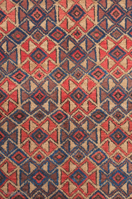 Baluch rug, late 19th century.  Camel wool ground and full pile.  Seljuk-like overall hooked medallion designs.  91 x 162 cm.  Contact danauger@tribalgardenrugs.com       