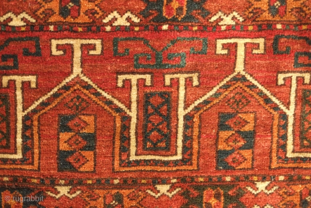 Ersari jollar, late 19th century.  Good colors with an apricot and a deep green.  Motifs resembling portals or grave stones topped with ram's horns for protection.  One small spot  ...