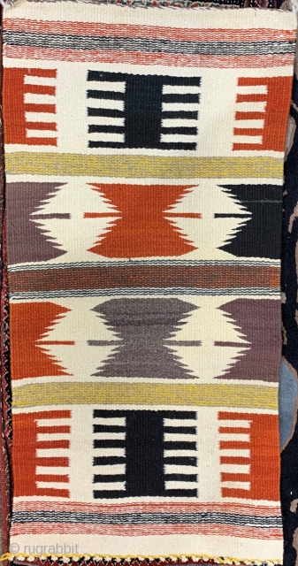 Navajo saddle blanket with unusual colors and strong graphics.  Please ask for additional photos.                  