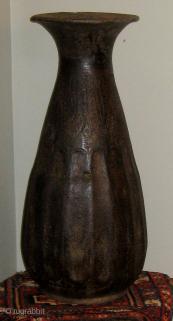 14th-15th Century oversize Khmer temple vase, incised decoration on  the upper half, faceted bottom half, some restorations.  Approximately 24" high, 11" across at its widest.  Please ask for additional  ...