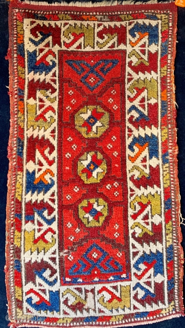 Antique North West Anatolian small yastik from the first quarter of the 20th century, classic border, floppy handle, dyes are a mixed bag.  Please ask for additional photos if needed.  