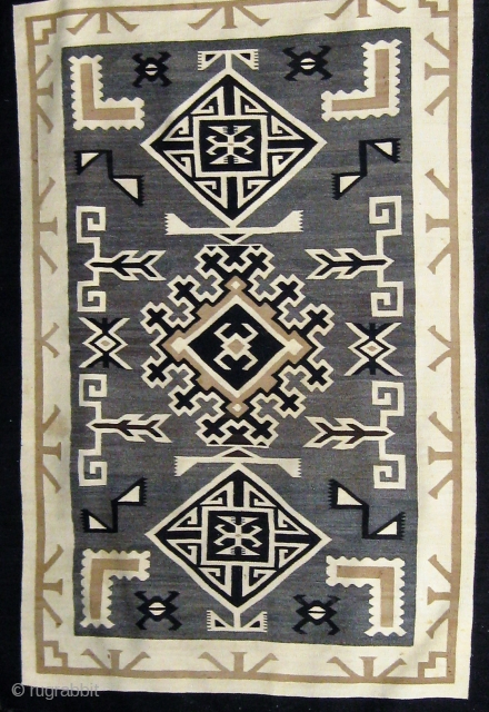 Antique Navajo "Two Grey Hills", circa 1925-1930, 48" by 70", all undyed wool, very fine weave (40 to 50 wefts to the inch), in good condition (one small repair to the edge  ...