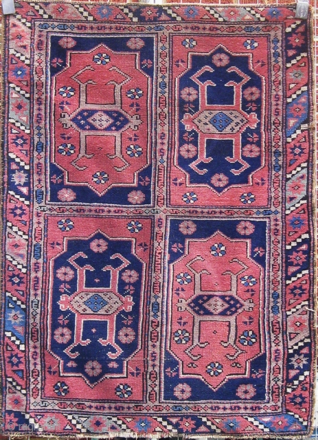 Antique Bergama area Canakkale carpet, circa 1900.  Very unusual format with four large cartouches in the field.  Edges original.  Muted palette with a lovely blue-green not obvious in photos.  ...