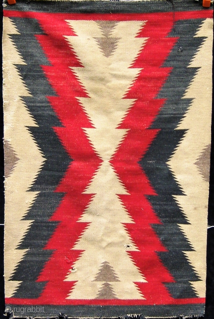 Antique Navajo rug, first quarter of the 20th century.  Some obvious condition issues.  Please ask for additional photos if needed.           