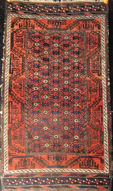 Antique Baluch, circa 1900.  Complete, with unusual extra pile banding on both ends.  Good overall condition with oxidized brown.  Edges and sides original.  33" by 59".   