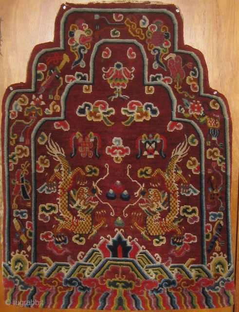 Rare antique Tibetan throne back cover, early 20th century, in pristine condition with original brocade back.  Approximately 15 colors.  Definitely Tibetan made, cut Senneh loop on wool foundation.  For  ...