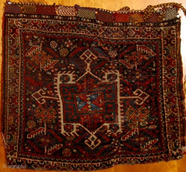 Antique Khamseh half khorjin complete with original flat-weave back, 19th century, all natural dyes.  Lower left corner compromised, original closure systems still present.  23" by 27".  Please ask for  ...