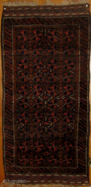 Small antique Baluch carpet (designed like a large balisht), pristine condition, original ends and edges, all natural dyes, circa 1900.  47" by 23". This rug was stored for half a century  ...