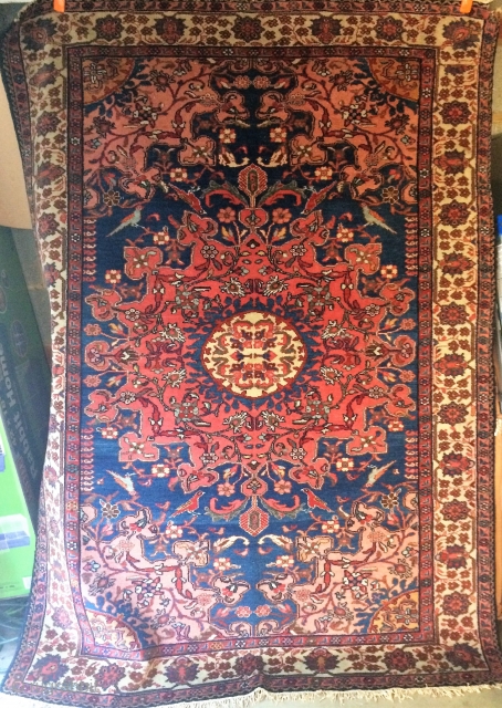 Antique Tafresh Persian rug, circa 1920s.  Beautiful salmon field, and playful birds.  With soft wool, and in lovely condition except for one bite in top right corner.  4'6" by  ...