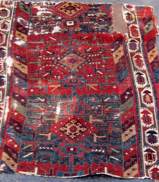 Kurdish/Anatolian fragment, early 19th Century or before, 38" by 46", with an extraordinary array of saturated colors.  Reddish wool wefts, white cotton warps.  Photos taken outside in mostly sunny conditions.  ...