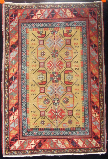 Antique South Caucasian small rug (Kuba?), extremely fine weave, velvety feel, all natural dyes, cotton foundation (warps and wefts), beautiful olive green field, in lovely condition, and basically complete with three cord  ...