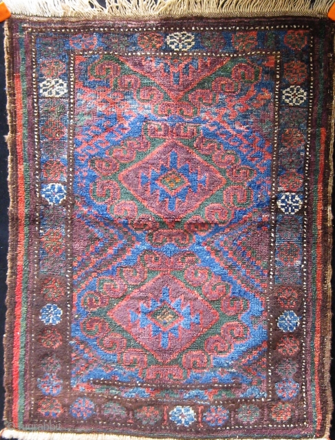 Antique S.E. Persian Baluch balisht, with lovely colors including a good deal of green and aubergine.  Original edges, bottom end slightly reduced.  32" by 24".      