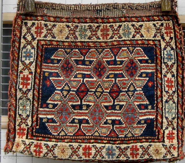 NW Persian bagface with added flat woven back (probably not original), some tip fading, circa 1900, 20" by 22".              