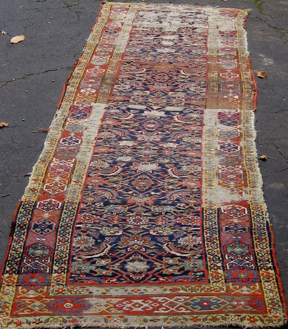 NW Persian Kurdish runner in fragmented condition, circa 1880.  Approximately 14 feet long. Please ask for additional photos.              