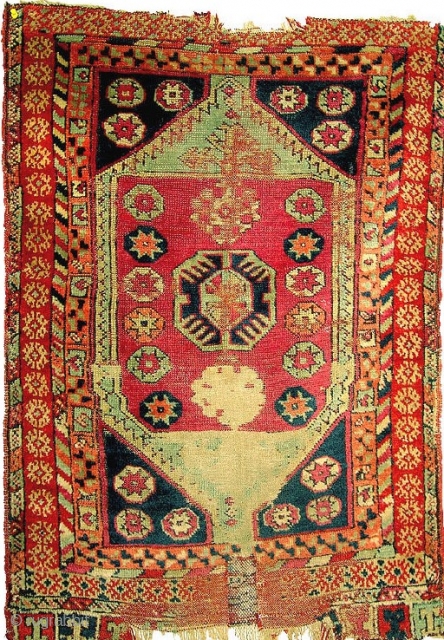 19th century Central Anatolian large yastik, lovely natural colors including madder, cochineal, apricot, various shades of blue, ivory, brown, etc.  In fragmented condition, but with original edges still present.  27"  ...