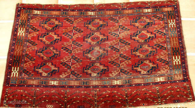 TURKOMAN YAMUT TENT BAG. A really unusual bag face with rich colours. The use of the "drynak" gul as the secondary design is rare. This is more usual to be found in ...