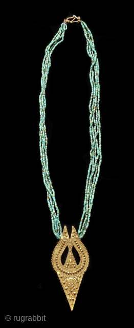 North India , Himachal Pradesh
early 20th c. 22k Gold pendant with fine small Afgan tourquoise beads.                 