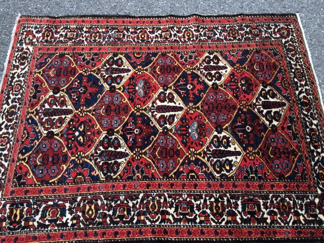 Persian Bakhtiari rug (1940s) from Chahar Mahal region. wool on cotton. nice pile and all good dyes. it measures 6'9" x 5'2"           