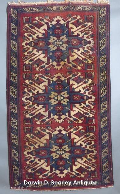  Antique Caucasian, "Eagle Kazak" or "Karabagh", c.1900-1920(?), 85" X 47",
Has wear and a few moth bites a small hole and also has a few stains as well.
SOLD     