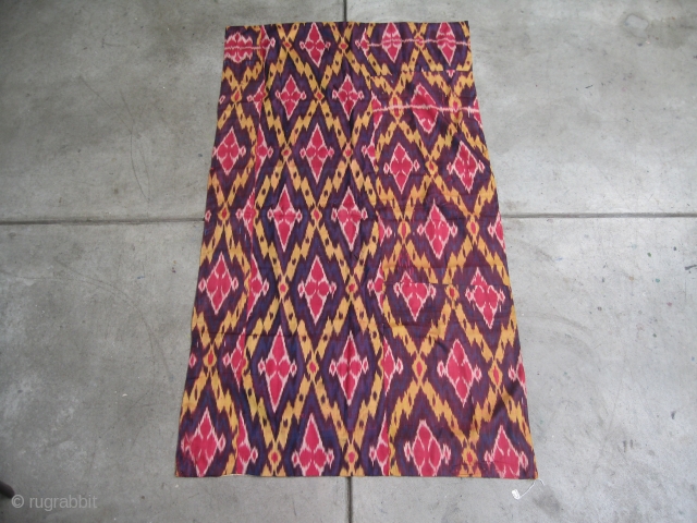 Uzbek all silk ikat panel. Late 19th century.Five colors.63 X 34 inches.lined with Russian cotton trade cloth. Condition good with one tiny stain .         