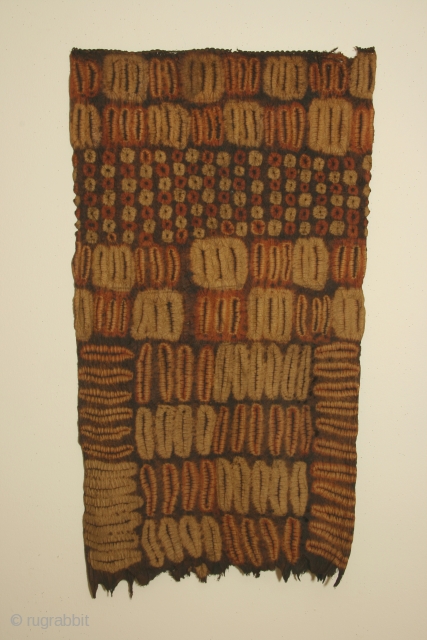 Africa: woman's tubular garment of resist dyed rafia fiber, each side 20 x 30 inches (51 x 100cm) Dida tribe, Ivory Coast, circa 1900, with some wear and losses.    