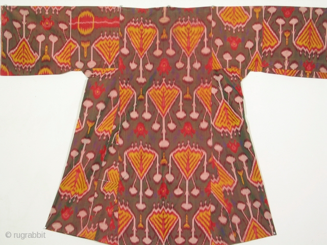 Uzbek woman's dress with resist dyed silk warps and red silk wefts. Dimensions: 69 inches across the shoulder and 50 inches high (175 x 127cm), late 19th century. Uzbek ikat dresses are  ...