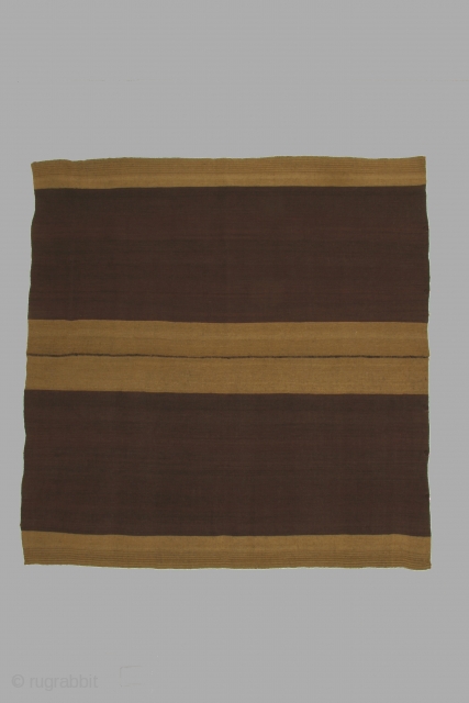 Bolivian mantle (nanaka) with bands of undyed vicuna colored alpaca wool on a ground of purple dyed sheep's wool, 40 x 41 inches (102 x 104cm), circa 1900-1950. The use of alpaca  ...