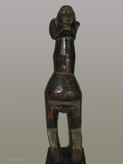 Africa, Mumuye wood figure, Nigeria, Benue River Valler Region, height 18 inches, circa 1900-1950, fine dark patina. Provenance:Gallery Argile, Paris
Facial features of eyes, nose, and mouth are flattened onto the form of  ...