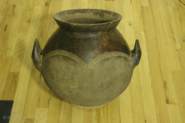 Africa, ceramic storage pot, Burkino faso, 18 inches high, 17inches across the handles, 20thcentury.                   