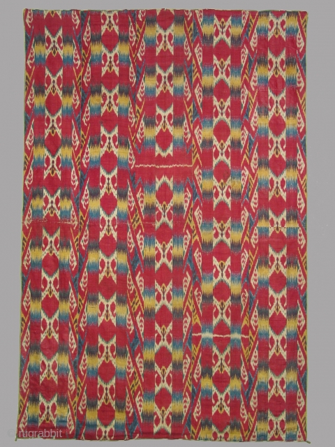 Uzbek ikat wallhanging, five loom widths wide,55 x 82 inches (140 x 208cm), 19th century, silk warp and cotton weft, with a lining of Russian printed fabric. In excellent condition.   