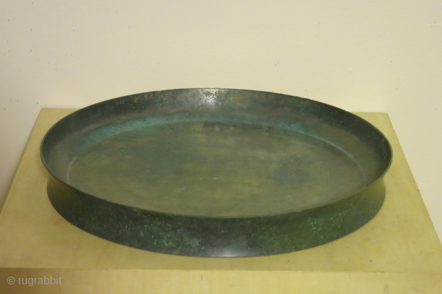 Cambodian bronze tray, Khymer, Ankor period, Baphuan style, circa 12-13th century, 13 inches in diameter, 1 1/2 inches high, probably made for temple offerings. In excellent condition with a fine even overall  ...