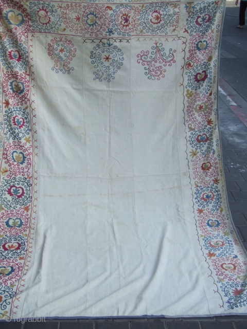 ANTIQUE UZBEK SILK HAND MADE- EMBROIDERED SUZANI
218x143-cm  / 85.8x56.2-inches
This is a Suzani silk on cotton hand made embroidery .
beautiful floral design.this is very unique item.
The suzani  in very good condition  ...