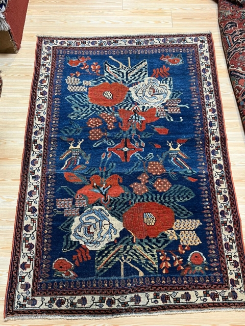 AFSHAR HANDMADE 
SIZE:180*125
AGE:18 TH 
MATERIAL:WOL
a collection of antique carpets on the sit                     