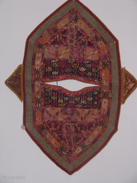 This turkmen child kirlik is an hand stitched silk on cotton in a fair condition
the wear on some spots shows that it was used by a very active child for a long  ...