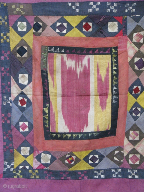 This is an old koraq(patch work)with a silk ikat in the middle part, uzbek tribe from northern Afghanistan,was used as a mirror cover(aenah posh)in the old days,
still in a very good condition. 