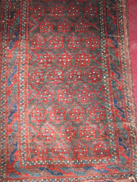 This is an real old beluch balesht with boteh design, all natural colors and the backing has also been decorated with nice designs, the original goat hair wrapping is tacked all around.  ...