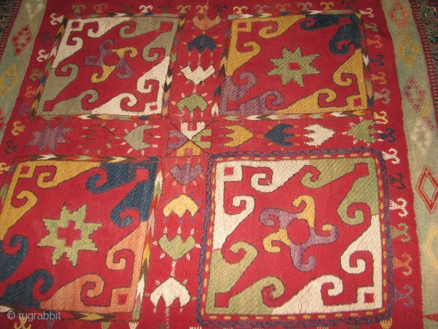 Interesting laqi suzani wool on wool square piece not turn of century old but nice enough to decorate a corner with it.           