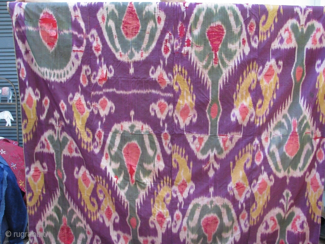 This is a very old ikat with a nice red cotton and green silk border backing superb colors front and back            