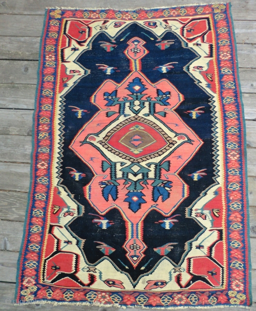 Antique Bijar Kilim Rug 3.5 Ft. x 5.25 Ft.
A dynamic design with a great color combination makes the center medallion seem to float in mid-air. This rug has a magnetic quality. The  ...