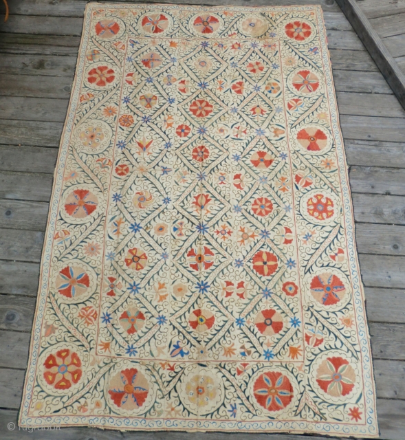 19th Century Uzbek Suzani 52-1/2" by 84"
The ground of this suzani is made from five handwoven panels of cotton and the embroidery is silk in all natural colors. All embroidery is done  ...