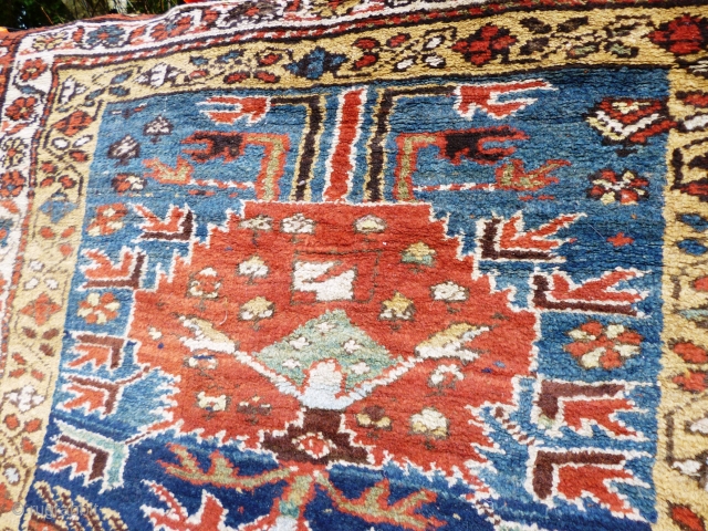 North West Persian Runner. Fragmented: missing outer border section, heat related damage in same area. Otherwise full pile with minimal damage. Good colours and interesting anthropomorphic motifs - see photos. Needs a  ...