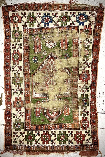 Old Yuntdag Bergama Turkish prayer rug. Worn, re-weaves, sides reduced. Size: 141 x 87cm. Free Postage within UK.
For international postage please ask           
