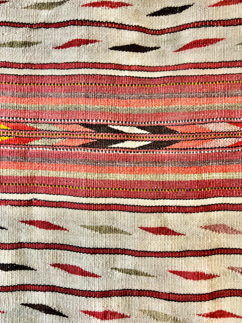 An antique Kashgar kilim: finely spun wool, warp and weft, with a floating, geometric design of soft colours: aubergine, moss green, yellow, dark brown/black, red, pink, orange, ivory. In good condition for  ...