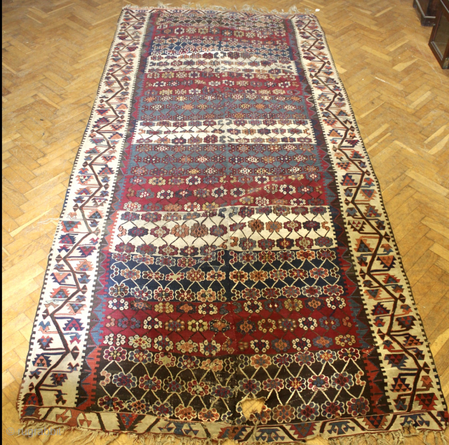 A large old Anatolian Kilim. Possibly from Corum / Cankili area of Central Turkey. Woven in two parts, then joined. Pure wool. Size: 290 x 165cm. One or two holes. New acquisition.  ...