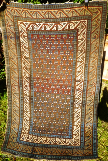 Ancient and charming little Caucasian Kuba rug with Seychour double border and dazzling abrashed main field with lattice of palmettes including pea green highlights. Original condition with a couple of tiny holes:  ...