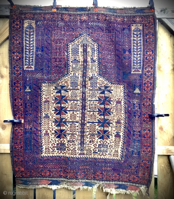 Old, worn, Afghan Baluch tree of life, camel ground prayer rug. Wool on wool with Numerous silk highlights: white, lime green, mauve, pink, etc. Holed and damaged. Original sides and ends. Size:  ...