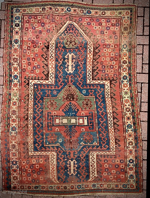 Fachralo double-niche Kazak rug, low pile with foundation showing in places. Two very small holes in field. Sides need overcasting. 204 x 134 cm

Please contact dom@dominicorr.com       