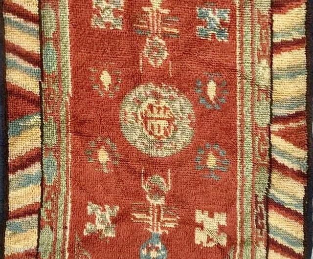 Chinese carpet with Turkestan motifs. Wool on cotton. Minor losses and re-piling in places, sides re-bound. Evidence of fuchsine. Overall full, even pile. Good colour. Affordable.
Size: 112cm x 72cm    