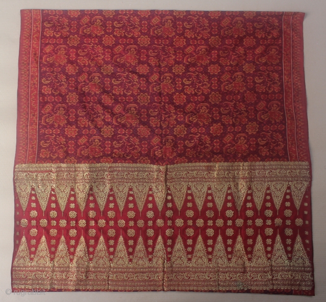19th Century textile,Limar sarong from Palembang, Indonesia. Size: if the saroong opened will be 200cm x 105cm. Condition: the tumpal (gold thread area) has some damage and has been repaired. the ikat  ...